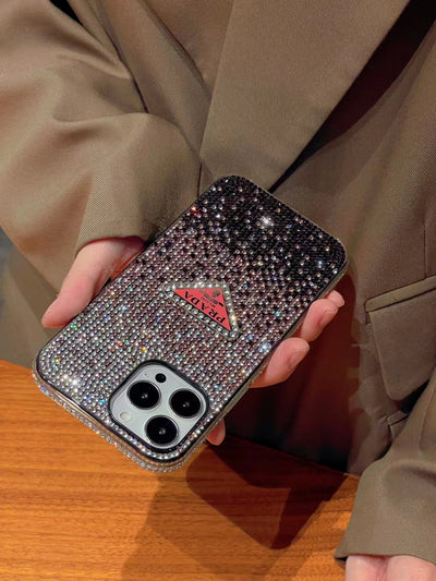 Luxury Prada Diamond iPhone Case on a marble surface.
