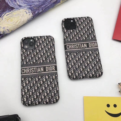 Sophisticated Dior logo gracing the high-quality exterior of the phone case