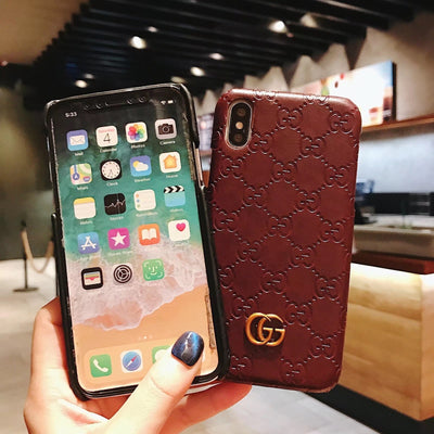 Close-up of Gucci Logo on Phone Case