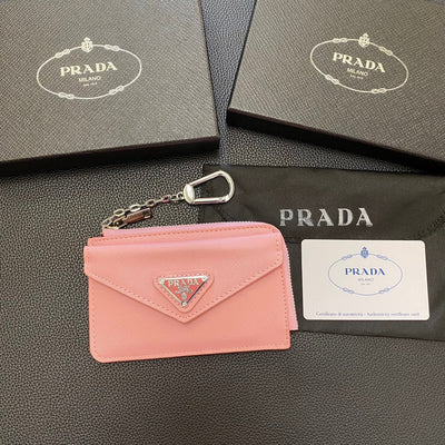 A stylish ensemble featuring a PRADA Classic Card Holder Wallet tucked neatly into a pocket, adding a touch of sophistication to the outfit.